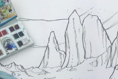 El impresionante paisaje montañoso de Vicki Speck capturado a través de su exquisita obra de arte. El dibujo detallado sobre papel muestra la pura belleza y tranquilidad de la naturaleza, con trazos intrincados que resaltan los majestuosos picos.